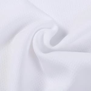 A close-up of white poly micro mesh fabric, showcasing its texture and lightweight feel. The material has a subtle pattern.
