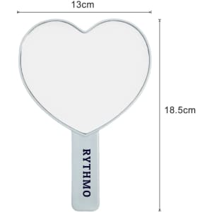 A heart-shaped handheld mirror with a white reflective surface and a handle, measuring 13cm by 18.5cm.