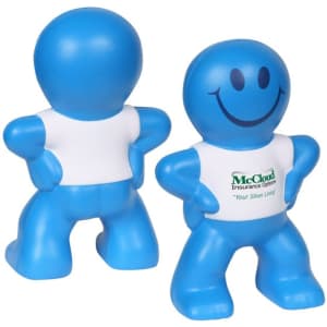 A blue stress reliever in the shape of a smiling cartoon figure with a white shirt featuring a logo.