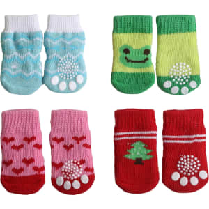 Four pairs of colourful pet socks in blue with patterns, green with a smiley face, pink with hearts, and red with a Christmas tree design.