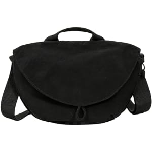 A casual black crossbody bag with a flap closure and adjustable strap, featuring a handle on top.