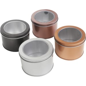 Assorted medium tins with transparent windows in black, silver, copper, and bronze finishes. Each tin has a logo.