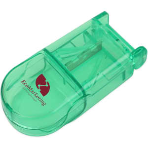 A green pill box with a built-in cutter, featuring a logo on the surface.