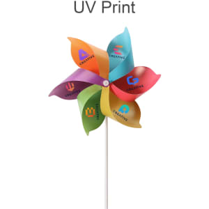 A six-leaf pinwheel featuring vibrant orange, purple, green, and blue petals, mounted on a white stick.