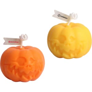 Two pumpkin-shaped candles in orange and yellow, featuring carved faces and topped with white wicks.