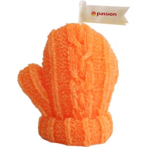 A bright orange glove-shaped candle with a textured, knitted appearance and a small flag attached.