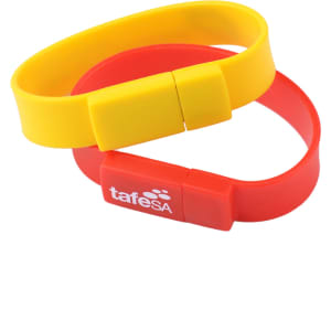 A red and yellow rectangular silicone wristband flash drive with a logo.
