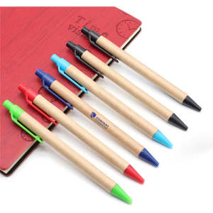 Seven Kraft Paper Pens in various colours—red, blue, green, black—with a notebook in the background.