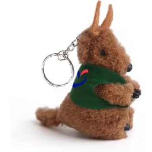 A brown kangaroo plush toy keychain with a green vest and a chain attachment. It has a logo on the vest.