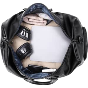 A black polyurethane duffle bag, open to reveal headphones, a tablet, a towel, and other items inside.