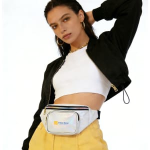 A holographic fanny pack in white, worn by a model, featuring a logo and set against a plain background.