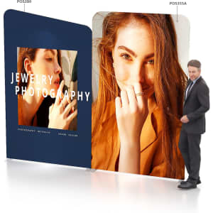 A straight tension fabric display wall featuring two large images, predominantly in navy blue, with a logo present.