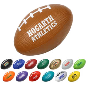 A brown rugby-shaped stress reliever with a white stripe and various smaller colourful rugby balls alongside.
