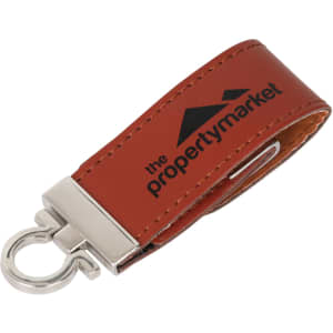 A brown leather keychain with a metal clip and a logo on the strap.