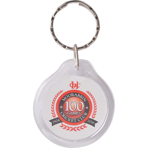 A round acrylic keyring with a silver metal keychain, featuring red and black branding elements.