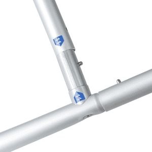 A close-up image of silver metal connectors for a display wall frame. Features a logo on the connectors.