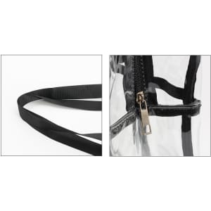 A clear tote handbag with black trim, featuring a zip closure and black straps. There's a logo visible.