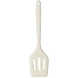 A white silicone spatula with a slotted head and a long handle, featuring a hanging hole.