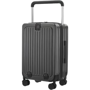 A grey hardside suitcase with a retractable handle and four wheels, featuring vertical grooves and a brand logo.
