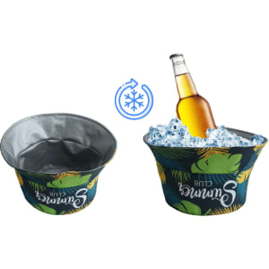 An insulated ice bucket in green and blue, featuring tropical leaf patterns, holding a drink bottle surrounded by ice.