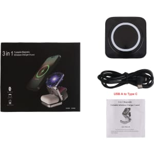 A foldable wireless charger stand in black, with a user manual and a USB A to Type C cable, displayed in its packaging.
