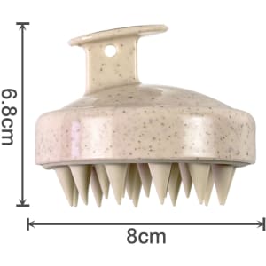 A hair scalp massager in a light brown shade with speckles and multiple pointed bristles for stimulation.