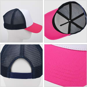 A premium vintage trucker hat featuring a white front, pink peak, and navy mesh back with an adjustable strap.