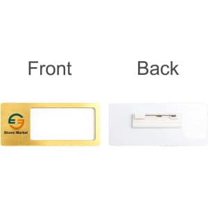 A gold reusable metal name badge with a clear front and a white back featuring a logo.