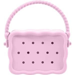 A pink silicone bag with a textured handle and multiple holes for ventilation. It features a rounded, scalloped shape.