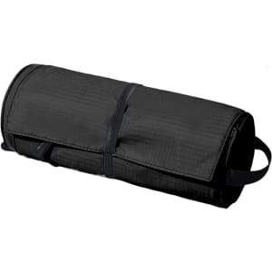 A black multifunctional toiletry travel bag rolled up, featuring a handle and a strap for secure closure.