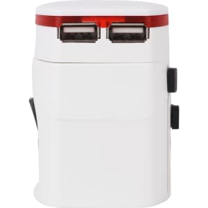 A white travel adapter with two USB ports and a red accent. It features a compact design with a built-in plug.