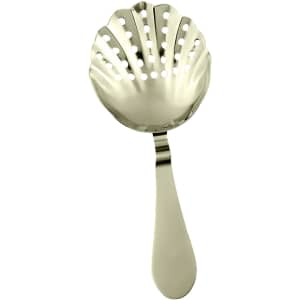 A metallic bar strainer with a shell shape and perforated design, featuring a smooth handle.