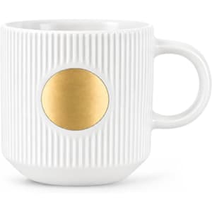 A ceramic mug in white with a textured design and a bronze medal feature on the front.