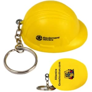 A yellow helmet-shaped stress reliever attached to a keyring, with a logo on the side.