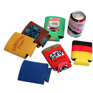 A collection of colourful foldable stubby holders in various designs, including blue, red, and yellow, alongside a can.