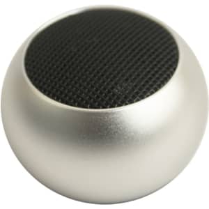 A silver mini bass wireless speaker with a round shape and a black mesh surface on top, featuring a logo.