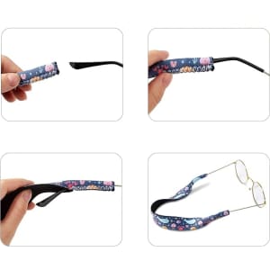 A glasses retainer in blue with playful designs, featuring a hand inserting glasses into the retainer.