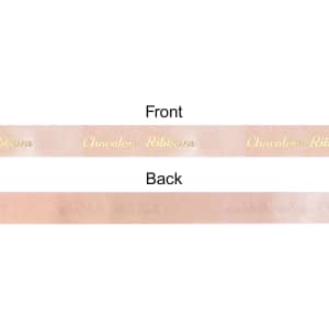 A satin ribbon in soft pink with a subtle sheen, featuring a front and back side. It has a brand logo on one side.