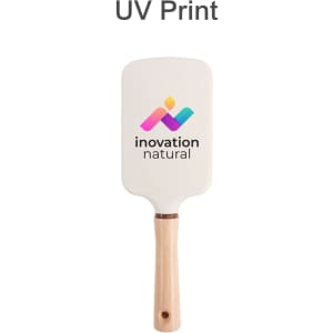 A paddle brush with a white head and a wooden handle, featuring a logo on the surface.