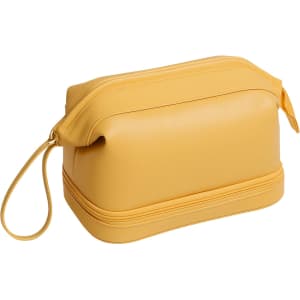 A large capacity toiletry bag in bright yellow with a smooth finish and a zippered top. Contains a handle for easy carrying.