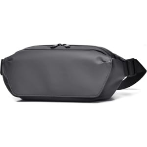 A grey fanny pack with a sleek design and adjustable strap, featuring a zippered compartment.