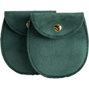 A pair of oval velvet jewelry pouches in dark green, featuring a button closure and a stitched edge.