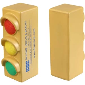 A traffic light-shaped stress reliever in gold, featuring red, yellow, and green buttons. Includes a logo.