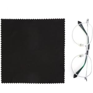 A black RPET lens cloth next to a pair of silver-framed glasses. The cloth has a zigzag edge.