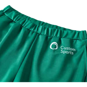 Green unisex adult sports shorts made of 100% polyester, featuring an elastic waistband and a logo.