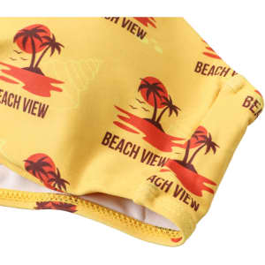 A yellow bikini top featuring a tropical design with palm trees and sunset motifs, including a logo.