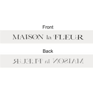 A grey soft ribbon featuring a logo on both sides, with elegant lettering in contrasting colours.
