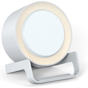 A circular white night light speaker with a wireless charging base, featuring a sleek, modern design.