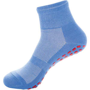 A pair of blue crew socks with red grip dots on the sole and patterned mesh sections. Features a logo.