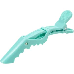 A turquoise alligator clip with an anti-slip grip feature and a textured top for secure holding.